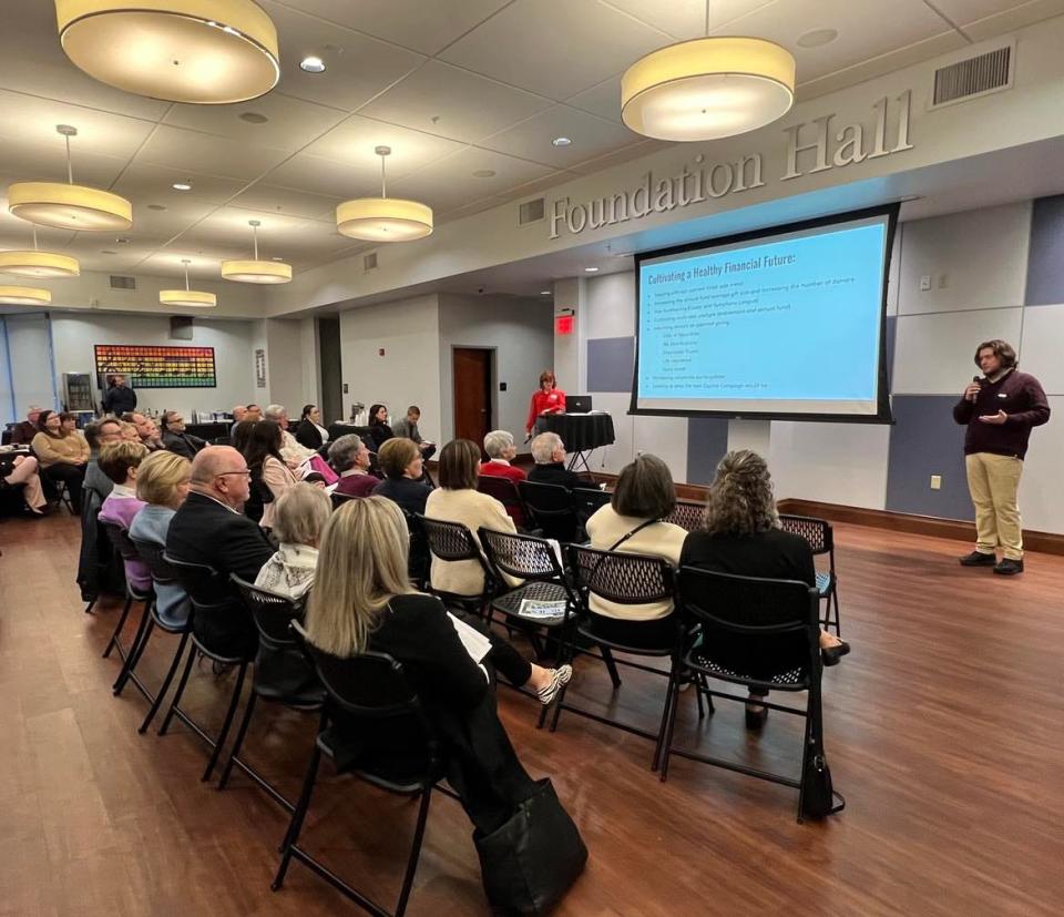 Rachel Hagemeier, president and CEO of the Canton Symphony Orchestra, makes a presentation recently to donors and supporters of the organization. She discussed the symphony's projected budget shortfalls and new ways it's approaching fundraising.