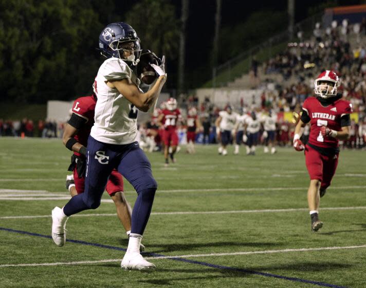 COSTA MESA, CA - SEPTEMBER 15: Sierra Canyon wide receiver Cole Crawford hauls in a 38-yard pass for touchdown in the second quarter against Orange Lutheran at Orange Coast College in Costa Mesa, CA on Friday, Sept. 15, 2023. (Myung J. Chun / Los Angeles Times)