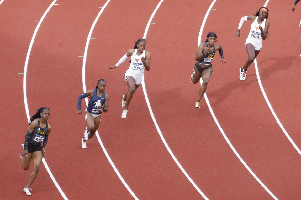 Runners compete in the 200 meter semifinals during the NCAA Division I Outdoor Track and Field Championships, Thursday, June 10, 2021, at Hayward Field in Eugene, Ore. (AP Photo/Thomas Boyd)