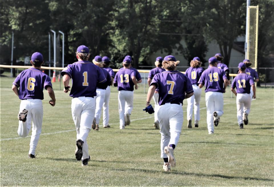 The Hagerstown Tigers take a jog to the right-field foul pole before a regional game against Heritage Christian June 3, 2023.