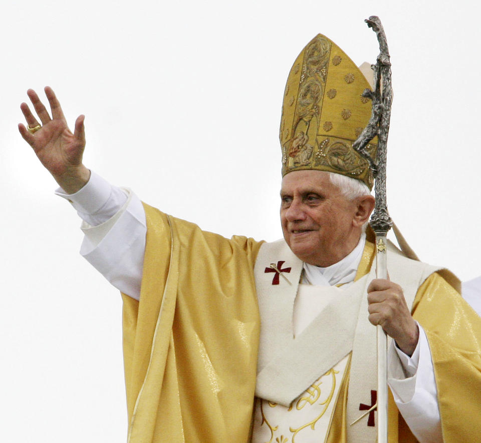 FILE - Pope Benedict XVI celebrates the concluding Mass of the World Youth Day with about one million pilgrims at the Marienfeld, southwest of Cologne, Germany, on Aug. 21, 2005. When Cardinal Joseph Ratzinger became Pope Benedict XVI and was thrust into the footsteps of his beloved and charismatic predecessor, he said he felt a guillotine had come down on him. The Vatican announced Saturday Dec. 31, 2022 that Benedict, the former Joseph Ratzinger, had died at age 95. (AP Photo/Martin Meissner, File)