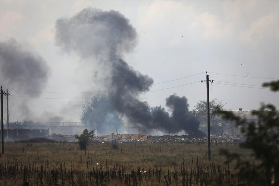 FILE - Smoke rises over the site of explosion at an ammunition storage of the Russian army near the village of Mayskoye, Crimea, Tuesday, Aug. 16, 2022. A spate of drone attacks that Russian authorities blamed on Ukraine has targeted areas in southern and western Russia, reflecting the Ukrainian military's growing reach as the war dragged into a second year. (AP Photo, File)