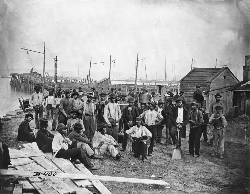 A group of freed African American slaves along a wharf during the United States Civil War.<span class="copyright">Bettmann/Getty Images</span>