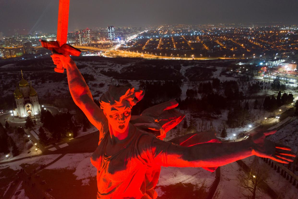 A giant statue of “Mother of the Homeland” is seen atop the memorial site on Mamayev Hill illuminated for marking the 80th (AP)