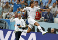 <p>France’s Raphael Varane, right, celebrates after scoring his side’s opening goal </p>