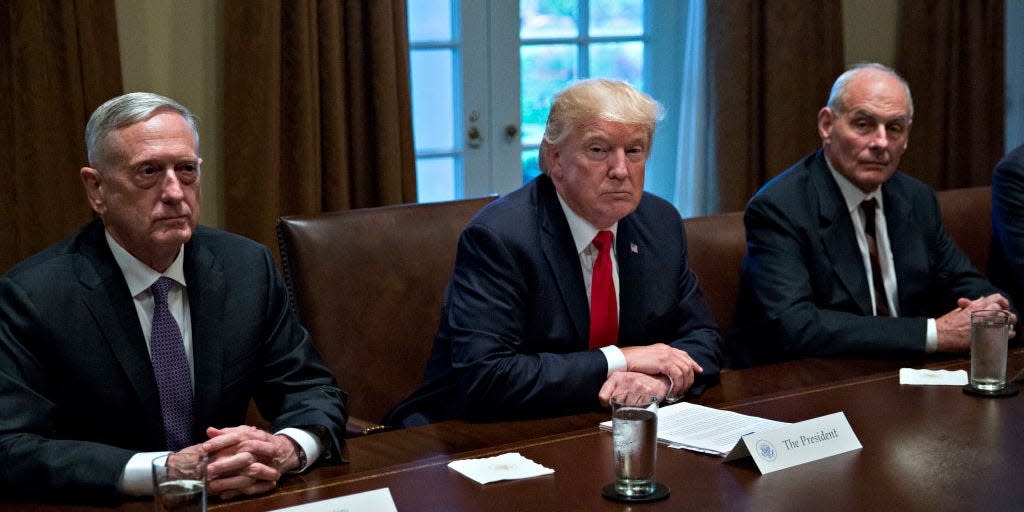U.S. President Donald Trump (C), White House chief of staff John Kelly (R) and Defense Secretary Jim Mattis attend a briefing with senior military leaders in the Cabinet Room of the White House