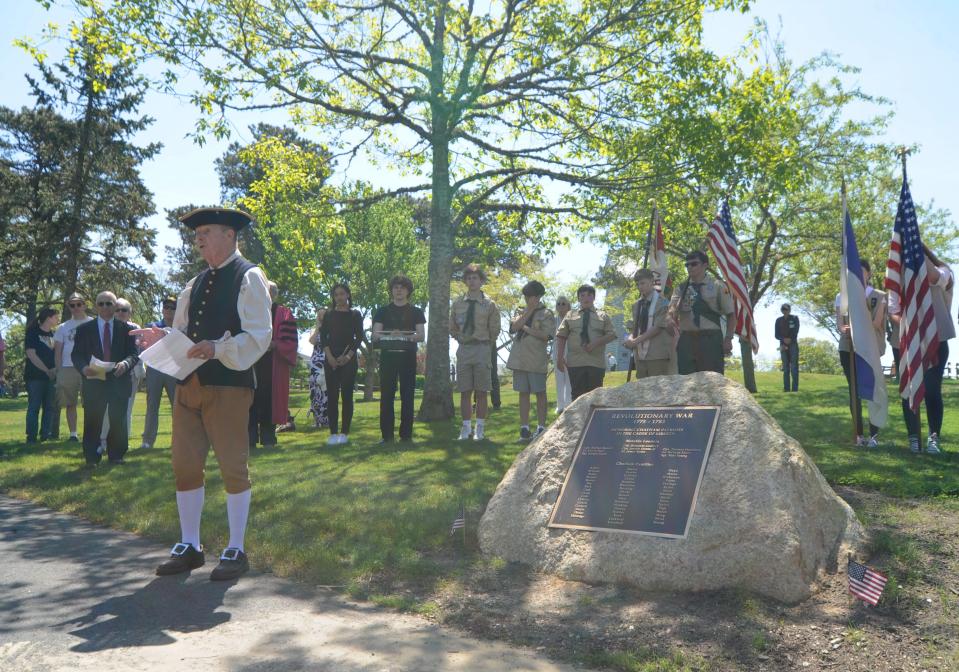 Dressed as Col. Benjamin Godfrey, William Cullinane, speaks during the dedication of the Revolutionary War Memorial at Chase Park in Chatham on Monday. To see more photos, go to www.capecodtimes.com/news/photo-galleries. Merrily Cassidy/Cape Cod Times