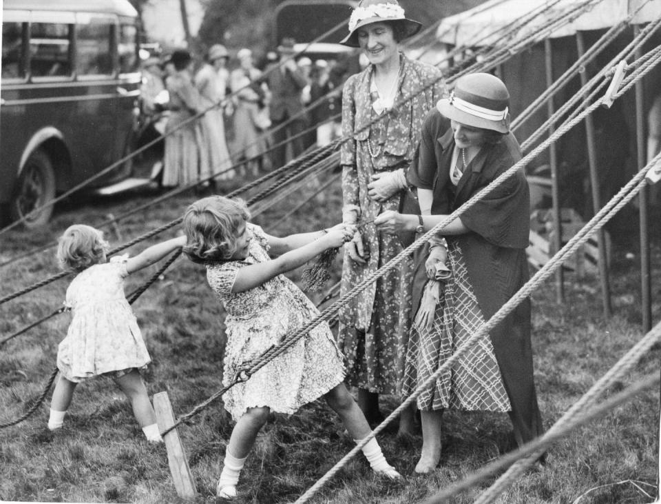 <p>While at a celebration at Abergeldie Castle in Scotland, Princess Elizabeth and Princess Margaret sold white heather to help the funds for Crathie Church. During a break in the festivities, the two girls found some rope to play with, because, why not?!</p>