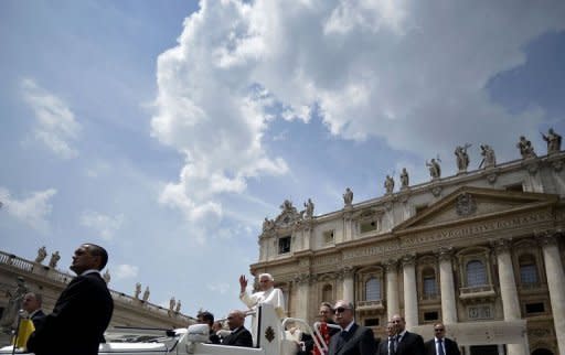 Pope Benedict XVI leaves on the Popemobile surrounded by Vatican gendarmes after his audience to the group renewal in the spirit in Saint Peter's Square at the Vatican. The Vatican on Saturday confirmed the arrest of Pope Benedict XVI's butler on suspicion of leaking confidential documents and letters from the pontiff's private study to the media