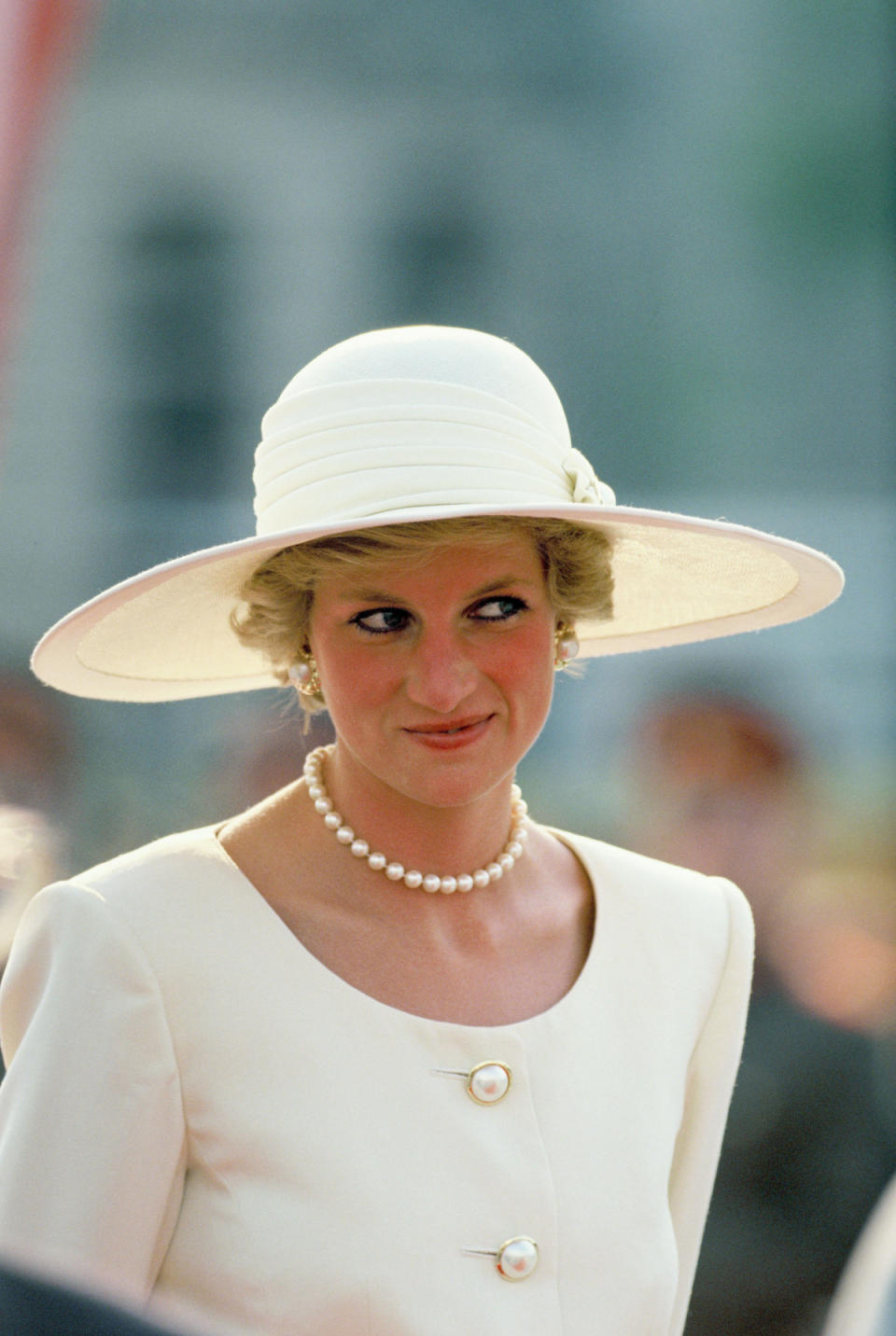 <p>For this daytime look in 1990, the princess chose a short-and-sweet choker strand of pearls. This classic Sloane-y element is as ripe for offbeat styling as it was then. (Photo: Georges De Keerle/Getty Images) </p>