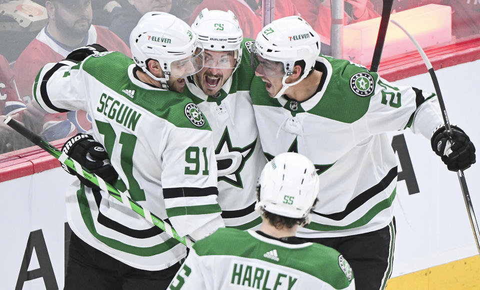 Dallas Stars' Tyler Seguin (91) celebrates with teammates after scoring against Montreal Canadiens during second period NHL hockey action in Montreal, Canada, Saturday, Feb. 10, 2024. (Graham Hughes/The Canadian Press via AP)