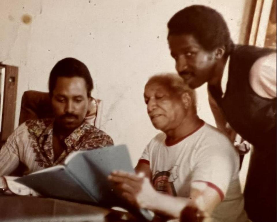 Larry Jackson Jr. (left) looks over a script with the late television star Redd Fox. On top of being an entrepreneur, Jackson had an interest in writing, and spent some time in Los Angeles trying to find TV work.