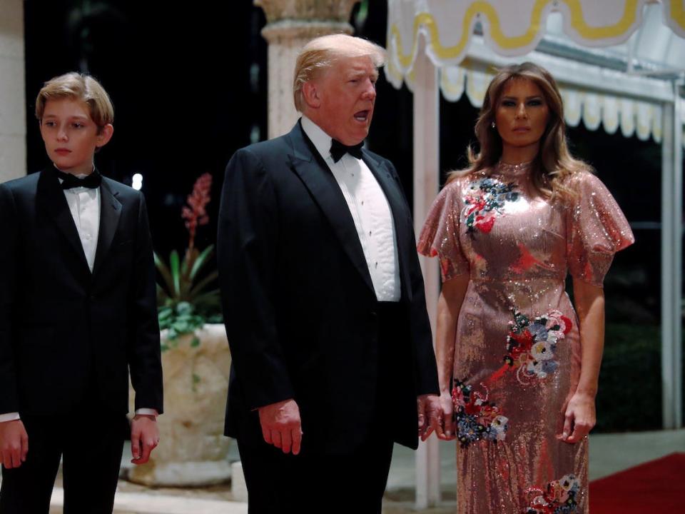 President Donald Trump and first lady Melania Trump, with their son Barron, arrive for a New Year's Eve party at his Mar-a-Lago club in Palm Beach, Florida in 2017.