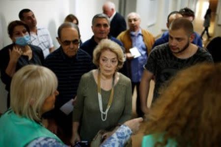 People wait in line to vote during the parliamentary election in Tbilisi, Georgia, October 8, 2016. REUTERS/David Mdzinarishvili