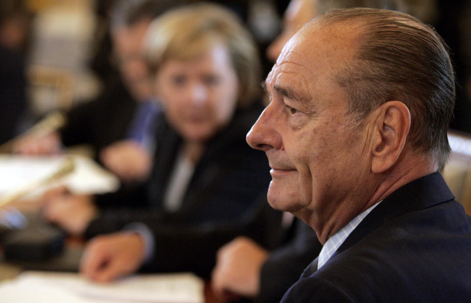 FILE - In this Monday, July 17, 2006 file photo, French President Jacques Chirac, right, attends a meeting at the G8 Summit in St. Petersburg, Russia. Jacques Chirac, a two-term French president who was the first leader to acknowledge France's role in the Holocaust and defiantly opposed the U.S. invasion of Iraq in 2003, has died at age 86. (AP Photo/Virginia Mayo, File)