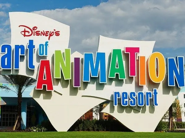 exterior shot of the main entrance sign at art of animation resort in disney world