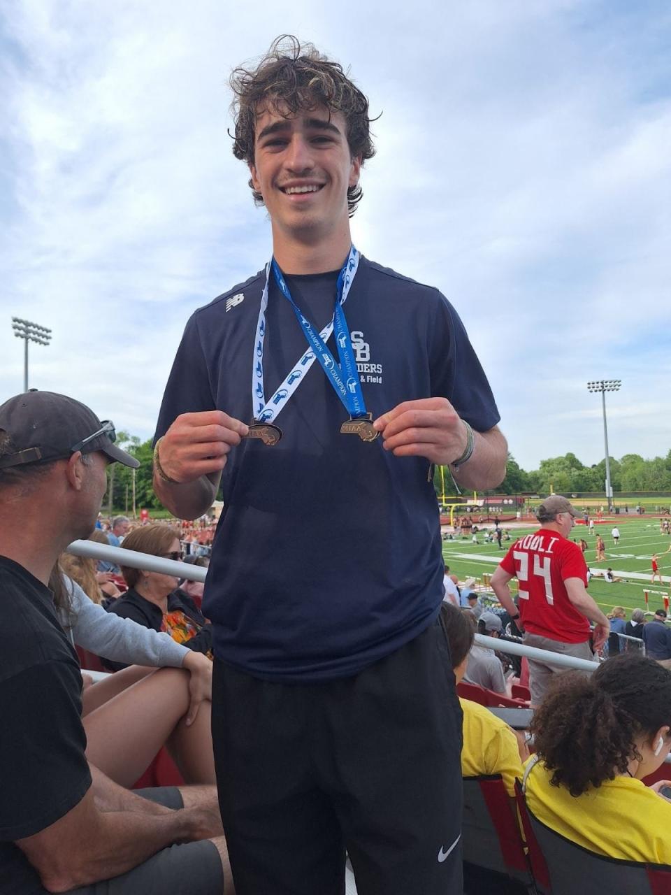 Somerset Berkley track and field star Camden Rose shows off his medals during the Division 3 state meet at Merrimack College.