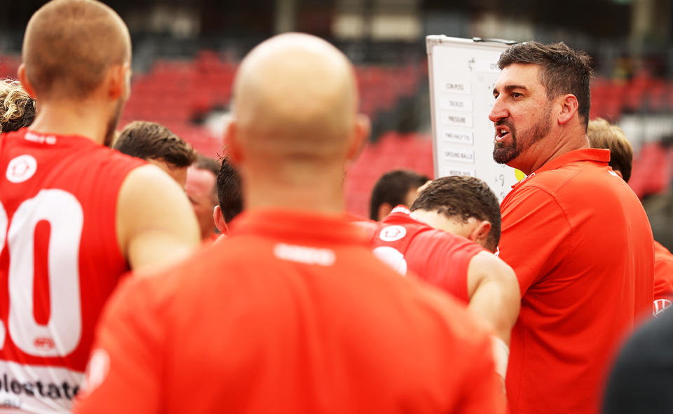 Dean Cox, pictured here speaking to Sydney Swans players.