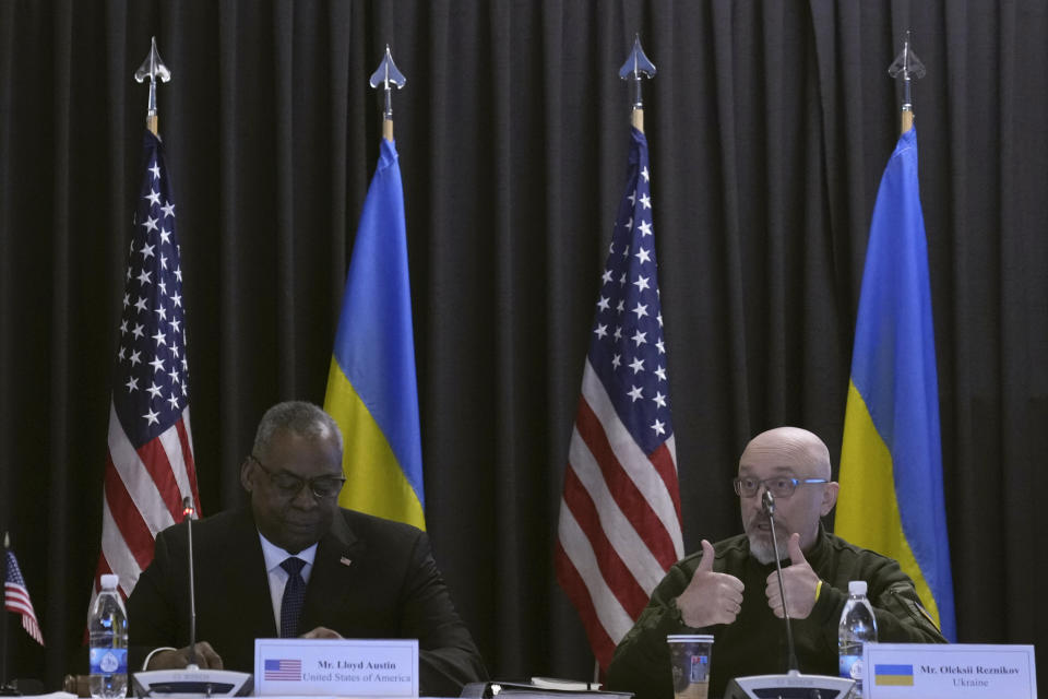 US Defense Secretary Lloyd Austin, left, and Ukrainian Minister of Defense Oleksii Reznikov attend the opening meeting of the 'Ukraine Defense Contact Group' at Ramstein Air Base in Ramstein, Germany, Friday, April 21, 2023. The U.S. will begin training Ukrainian forces how to use and maintain Abrams tanks in the coming weeks, as the U.S. continues to speed up its effort to get them onto the battlefield as quickly as possible, U.S. officials said Friday. (AP Photo/Matthias Schrader)