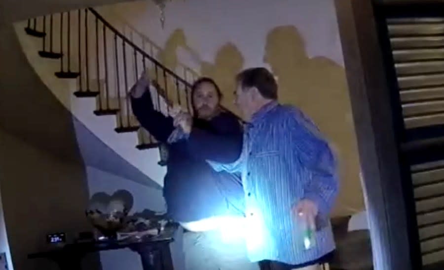 A police officer’s body camera video shows David DePape and Paul Pelosi struggling for control of a hammer on Oct. 28, 2022. (SFPD image)