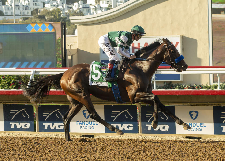 In this image provided by Benoit Photo, Flightline, with Flavien Prat aboard, wins the Grade I, $1,000,000 Pacific Classic horse race Saturday, Sept. 3, 2022, at Del Mar Thoroughbred Club in Del Mar, Calif. (Benoit Photo via AP)