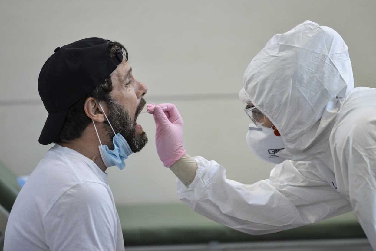 A man undergoes a swab test for Covid-19 at the testing site of Turin airport, Italy. (Getty)