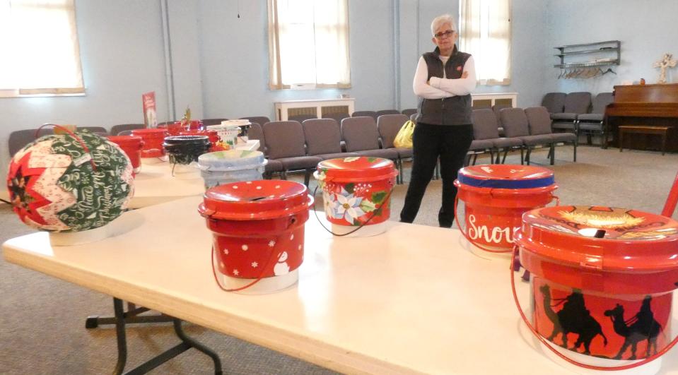 Major Debbra Grace, one of the Bucyrus Salvation Army's commanders, shows off the "Pretty Painted Pots" that will make their debut at the kettle campaign's kickoff event, 9 a.m. Friday at Bucyrus City Hall.