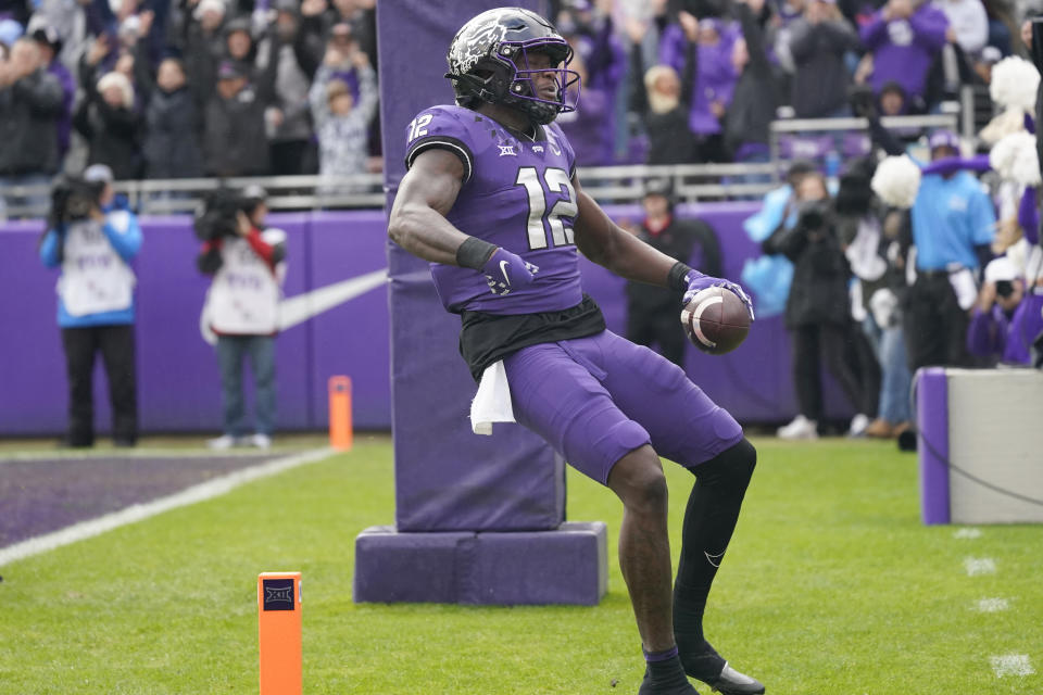 TCU tight end Geor'Quarius Spivey (12) celebrates scoring a touchdown during the first half of an NCAA college football game against Iowa State in Fort Worth, Texas, Saturday, Nov. 26, 2022. (AP Photo/LM Otero)