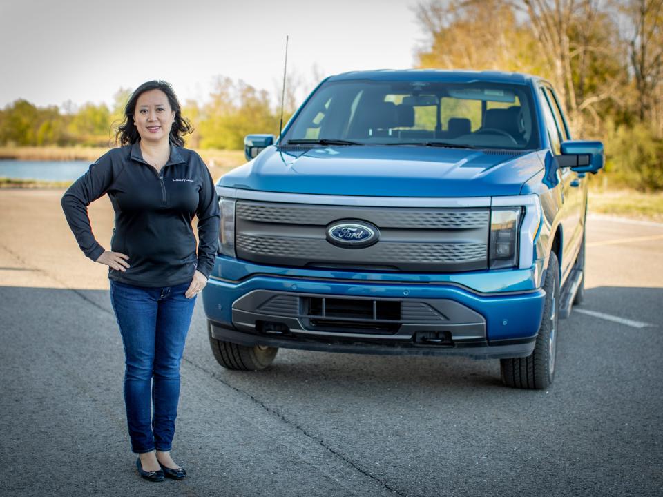 Linda Zhang stands in front of a F-150 Lightning.