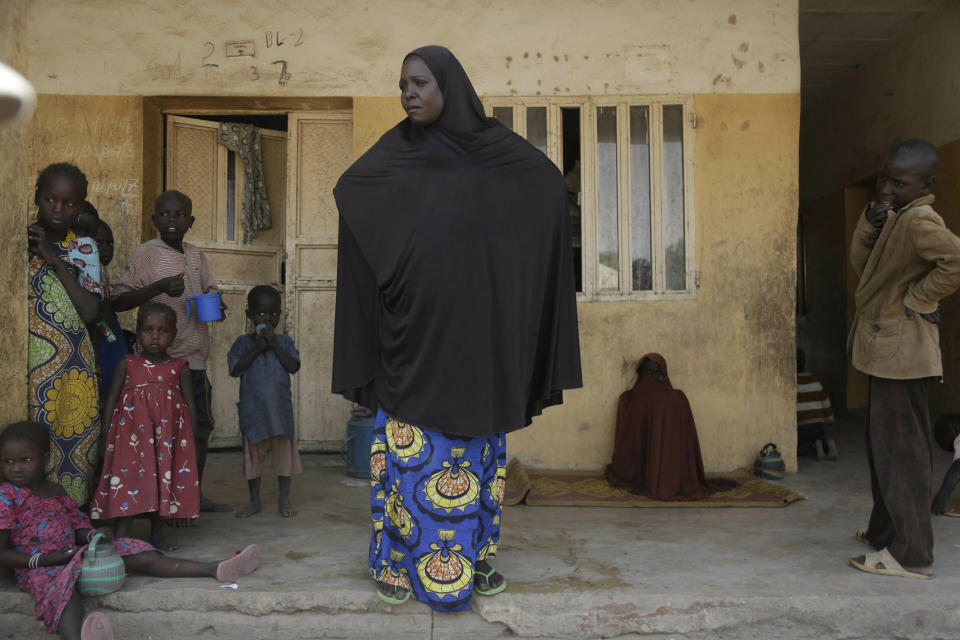 In this photo taken on Thursday, Feb. 21, 2019, Mariam Musa, 32-year-old, a woman displaced by Islamist extremist listen to a question at Malkohi camp in Yola, Nigeria. Mariam Musa says in the makeshift camp for Nigerians who have fled Boko Haram violence, the upcoming presidential vote isn’t a topic of conversation, because nearly all are more worried about putting food on the table. (AP Photo/ Sunday Alamba)