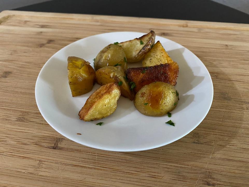 crispy roasted potatoes on a white plate