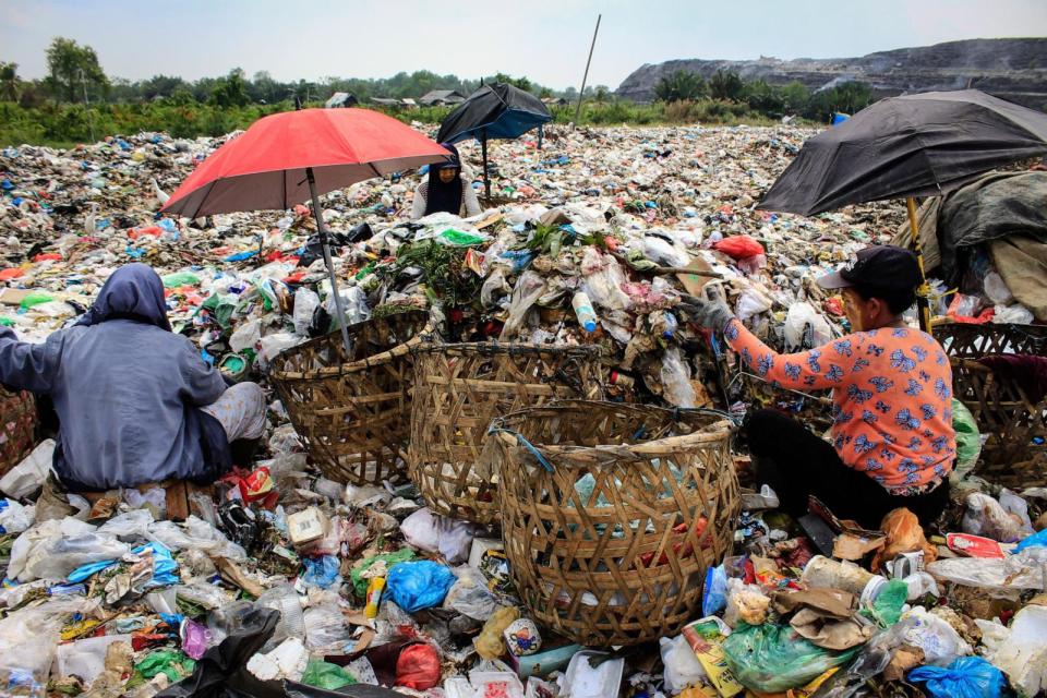 PHOTO: Scavengers collect plastic waste to sell to a recycling centre at a landfill in Medan, North Sumatra, March 27, 2024.  (Kartik Byma/AFP via Getty Images)