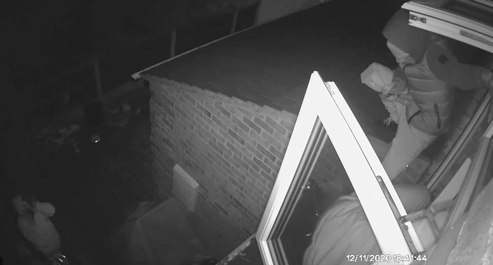 CCTV vision of three men breaking into a family home through a 4-year-old girl's bedroom window.