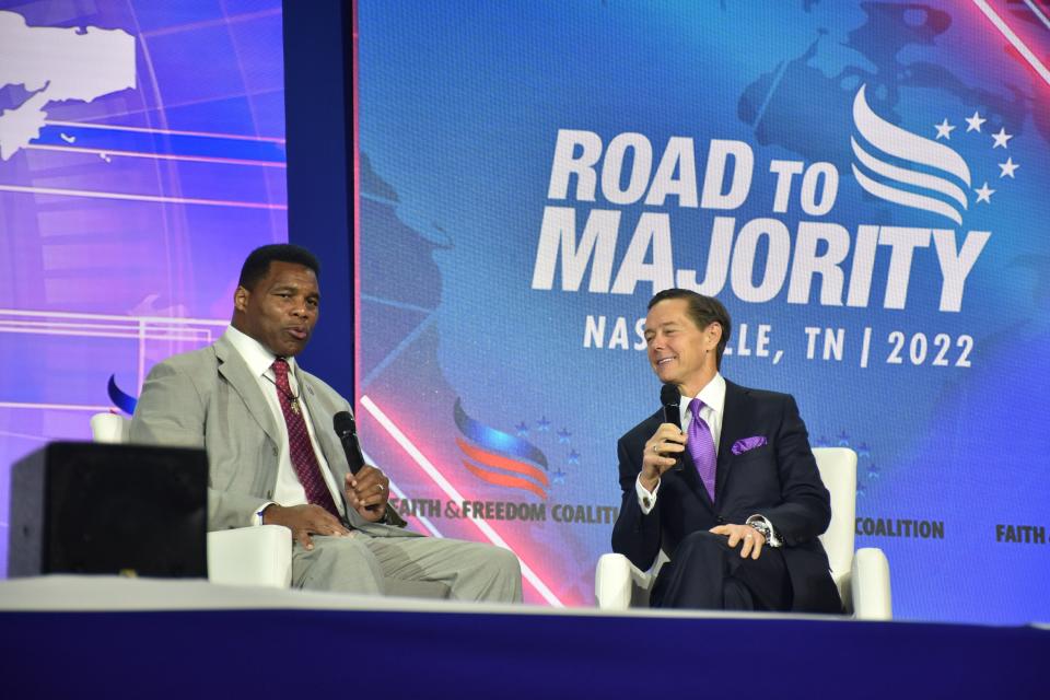 Herschel Walker, the Republican candidate from Georgia for U.S. Senate, speaks with Ralph Reed at the Faith and Freedom Coalition's "Road to Majority" conference in Nashville, Tenn., on Saturday, June 18, 2022.