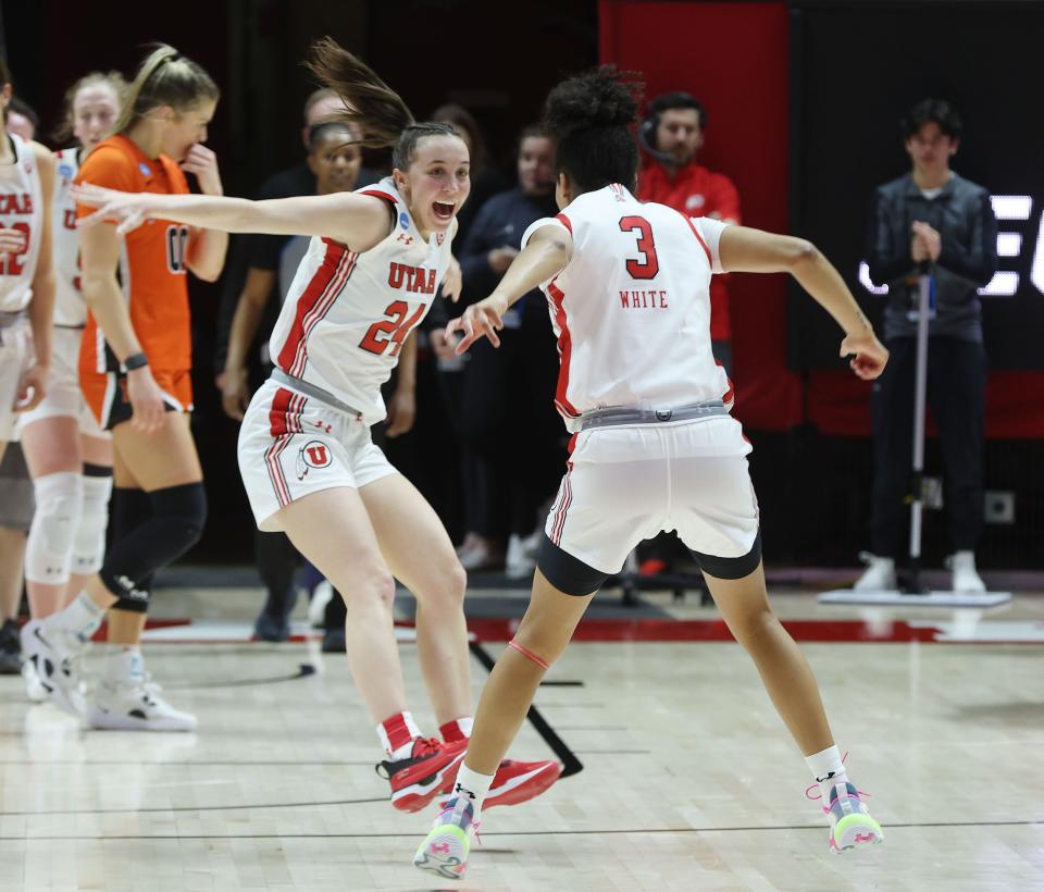 Kennady McQueen (24) and Lani White (3) celebrate Utah’s win over the Princeton Tigers.