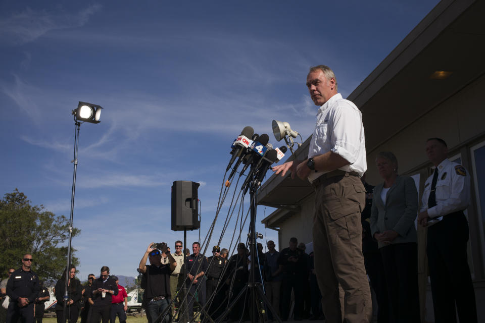 U.S. Secretary of the Interior Ryan Zinke speaks during a news conference at a command post as firefighters continue to battle the Woolsey Fire Thursday, Nov. 15, 2018, in Camarillo, Calif. (AP Photo/Jae C. Hong)