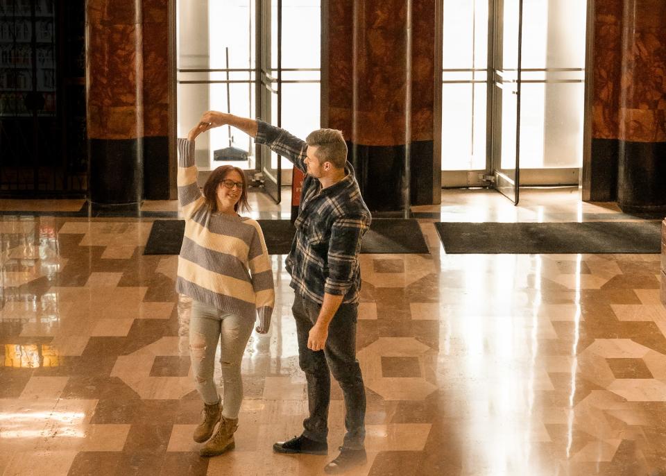 A couple on a blind date dances in the Guardian Building during K Marie Photography's first Stranger Session on Jan.14, 2024.