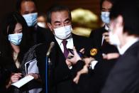 China's Foreign Minister Wang Yi speaks to media after meeting with Japan's Prime Minister Yoshihide Suga in Tokyo, Wednesday, Nov. 25, 2020. (Behrouz Mehri/Pool Photo via AP)