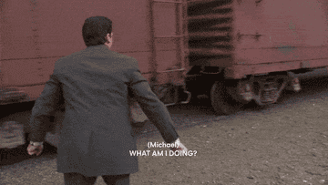 Michael says, "What am I doing? I'm blowing dodge. I'm getting out of town. Ugh, oh. Whatever you call it, I'm running away from my responsibilities, and it feels good," as he jumps onto a train cart pulling out of the station