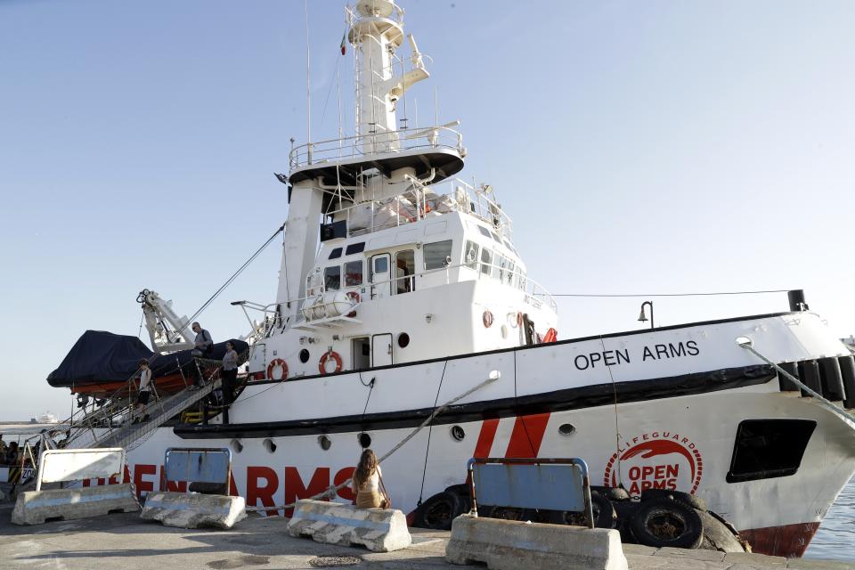 The Open Arms ship is moored at the Naples harbor, Italy, Thursday, June 20,2 019. The Spanish NGO migrant ship Open Arms is in Naples with activists speaking to media and the public to mark World Refugee Day. (AP Photo/Andrew Medichini)