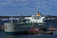 An oil tanker owned by Irving Oil is pushed towards a dock by tugboats Friday, April 23, 2021, in South Portland, Maine. On the second day of a virtual summit hosted by the White House, the United States and other nations are discussing ways to ramp up renewable energy development while decreasing the world's dependency on fossil fuels. (AP Photo/Robert F. Bukaty)