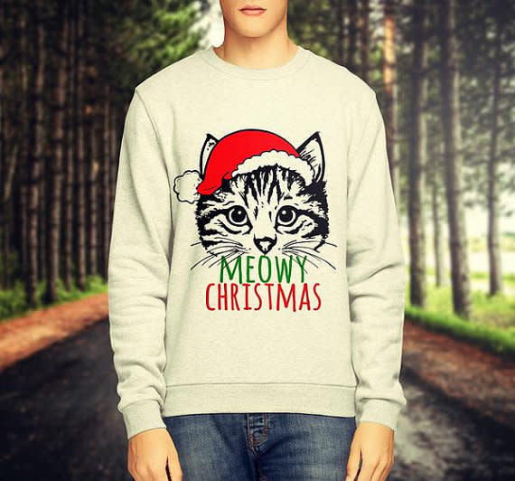 <p>£18.99, <a rel="nofollow noopener" href="https://www.etsy.com/uk/listing/490231453/unisex-grey-white-cat-print-meowy?ga_order=most_relevant&ga_search_type=all&ga_view_type=gallery&ga_search_query=Christmas%20jumper&ref=sr_gallery_19" target="_blank" data-ylk="slk:Etsy;elm:context_link;itc:0;sec:content-canvas" class="link ">Etsy</a></p>