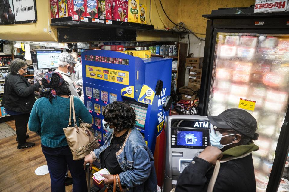 Customers line up for Powerball tickets at a grocery store in Brooklyn, N.Y.