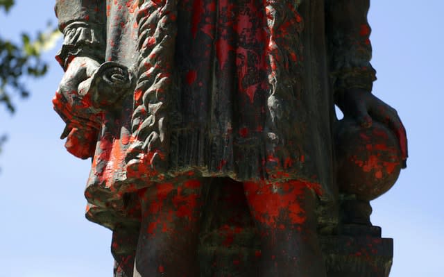 A statue of Christopher Columbus was discovered vandalised with red paint, in San Antonio, Texas (Eric Gay/AP)