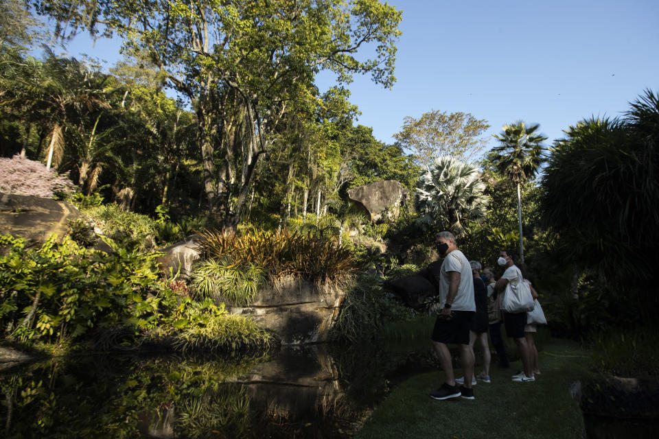 Visitors walk in the garden during a guided tour of Roberto Burle Marx’s former home, which was elected today as a World Heritage Site by the United Nations Educational, Scientific and Cultural Organization, UNESCO, in Rio de Janeiro, Brazil, Tuesday, July 27, 2021. The site features more than 3,500 species of plants native to Rio and is considered a laboratory for botanical and landscape experimentation. (AP Photo/Bruna Prado)