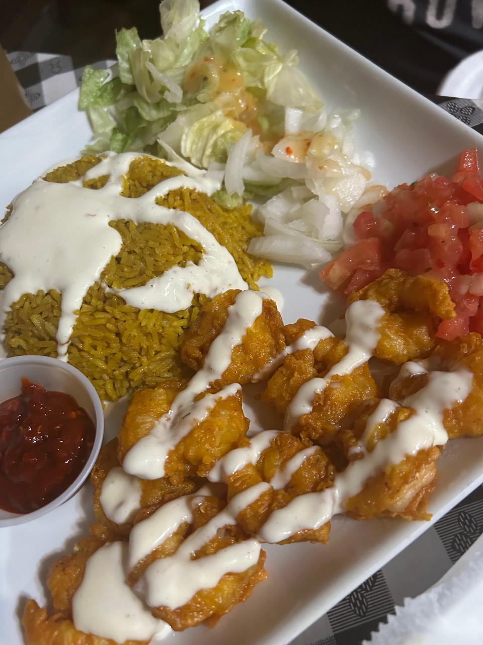 Shrimp over rice at Mid-East Cafe and Restaurant on the Zip Strip in Akron.