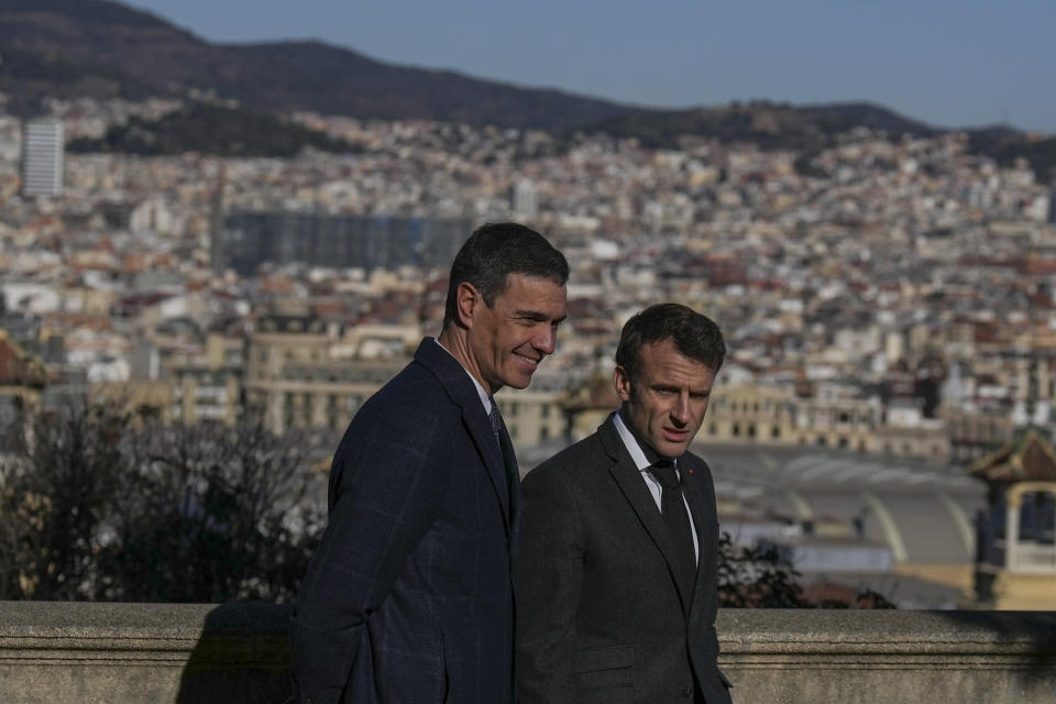 French President Emmanuel Macron, right, talks with Spanish counterpart Pedro Sánchez in Barcelona, Spain, on Thursday, Jan. 19, 2023. A summit between the Spanish and French governments, led by their executive leaders, prime minister Pedro Sánchez and president Emmanuel Macron, is held in the capital of Catalonia to strengthen relations between the European neighbors by signing a friendship treaty. (AP Photo/Emilio Morenatti)