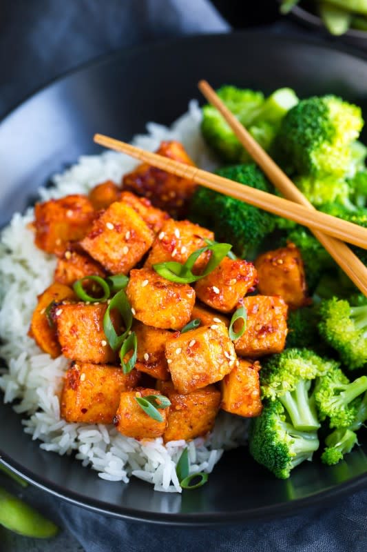 <p><strong>Get the recipe here: <a href="https://peasandcrayons.com/2018/10/spicy-sriracha-tofu.html" rel="nofollow noopener" target="_blank" data-ylk="slk:Sweet and Spicy Sriracha Tofu;elm:context_link;itc:0;sec:content-canvas" class="link ">Sweet and Spicy Sriracha Tofu</a></strong></p>