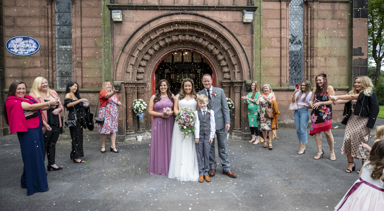 David D'Arcy and his wife Hayley Collins get married during their socially distanced wedding at St Anne's Church in Aigburth, Liverpool, as the lifting of further lockdown restrictions in England comes into effect. (Photo by Peter Byrne/PA Images via Getty Images)