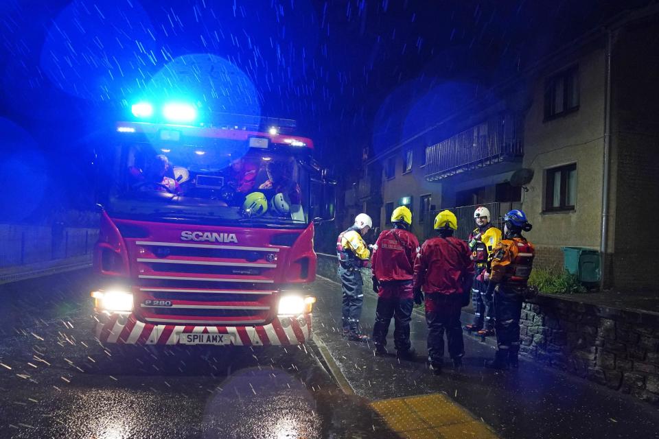 Emergency services in River Street in Brechin knock on doors and ask residents to evacuate (PA Wire)